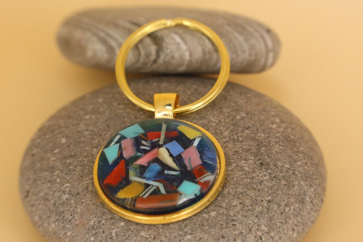 Gold Coloured Stainless Steel Round Keyring With Beach Clean Rubbish & Eco Resin