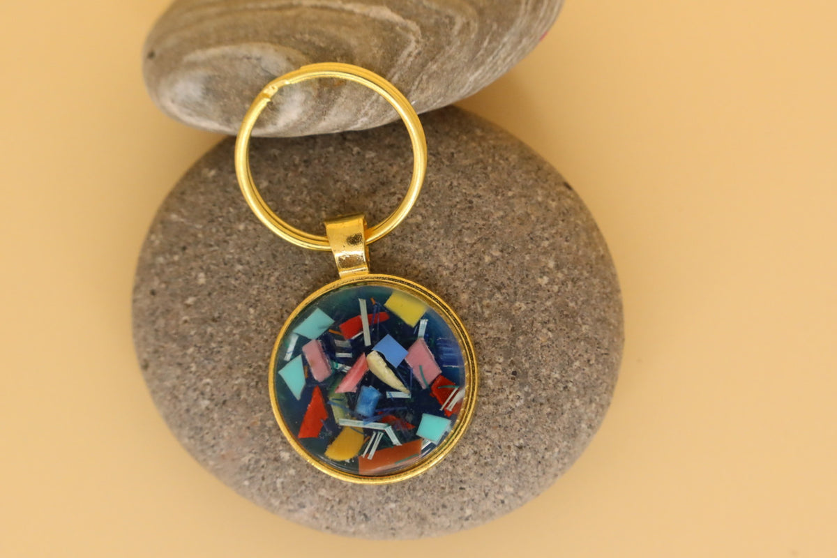 Gold Coloured Stainless Steel Round Keyring With Beach Clean Rubbish & Eco Resin